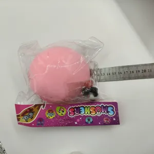 Pink slow rebound squishy stress ball toy in packaging with size measurement scale