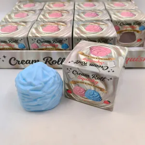 Close-up of a blue cream-shaped slow rebound squishy toy with its silver packaging box.