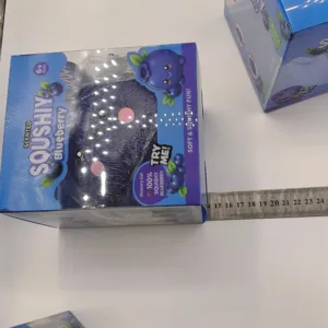 Large blueberry scented squishy toy in packaging shown with ruler for dimension