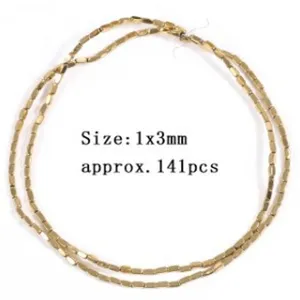 Close-up detail of golden hematite tube spacer beads, perfect for DIY jewelry crafting.