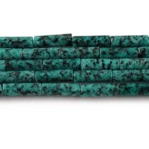 Close-up detail of natural picture jasper tube beads for jewelry making accessories.