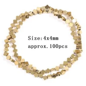 Close-up detail of golden four-leaf clover hematite beads, ideal for 4x4mm accessories.