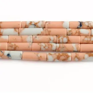 Pink imperial jasper tube beads macro detail view showing the unique natural marbled pattern texture.