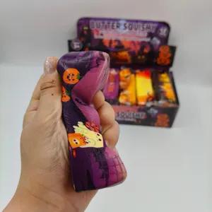 Close-up of Halloween ghost squishy toy in hand showing slow rebound texture and design.
