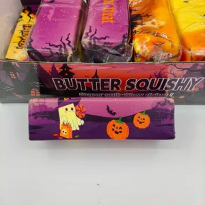 Close-up of slow-rising Halloween ghost and pumpkin themed butter squishy decompression toy