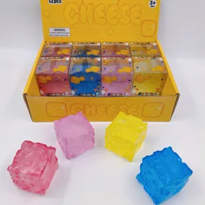 Detailed view of colorful cheese cube squishy stress relief toys in a retail display box