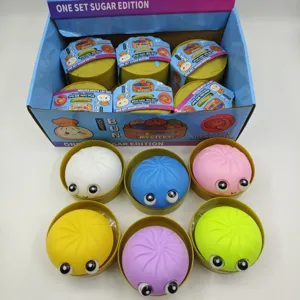 Juguetes blandos de bollos al vapor con ojos grandes en cestas de vapor para el estrés