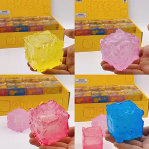 Close-up of translucent cheese cube squishy toys in multiple colors for sensory stress relief