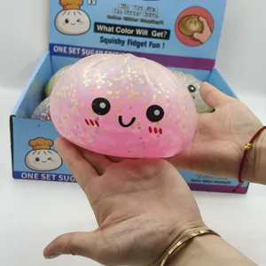 Μεγάλο ροζ γκλίτερ squishy παιχνίδι 15 εκ. σε σχήμα baozi με χαμόγελο