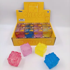 Colorful cheese cube squishy stress relief toys displayed in a 12-piece retail box set