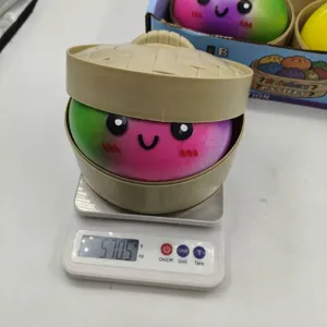Detailed shot of a 15cm colorful rainbow baozi squishy toy weighing 570.5g on a scale