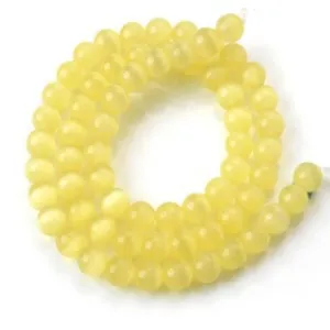 Yellow cat eye stone round beads with drilled holes for DIY bracelet jewelry making and accessories.
