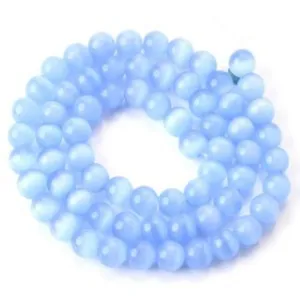 Detailed shot of light blue cat's eye gemstone beads strand for DIY jewelry making.