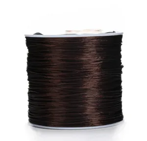 Detailed view of dark brown flat elastic cord spool, perfect for DIY bracelet beading crafts.