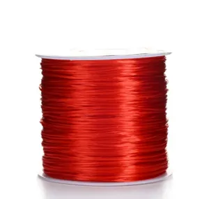 Close-up detail shot of vibrant red elastic beading cord wound neatly on a white spool.
