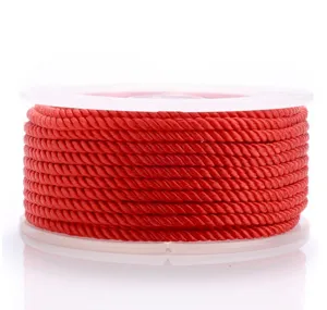 Close-up detail of red Milan cord spool, 1.5-3mm DIY braided necklace rope material.