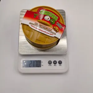 Balance électronique montrant le détail du poids du jouet de squishy de Noël