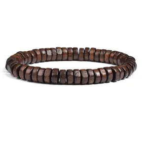 Close-up view of the dark brown wooden spacer bead bracelet, highlighting natural wood texture.
