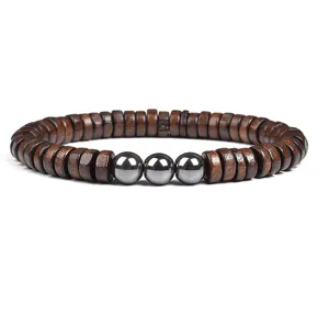 Wooden and metallic beaded bracelet detail shot, elegant brown and silver design.
