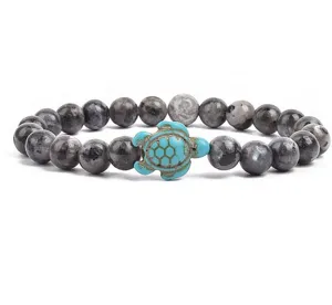 Detailed view of 8mm flash stone beaded bracelet featuring a charming turquoise turtle pendant.