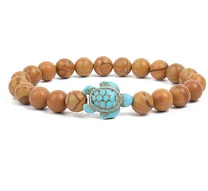 Natural wood grain stone bead bracelet featuring a cute turquoise turtle charm for women.