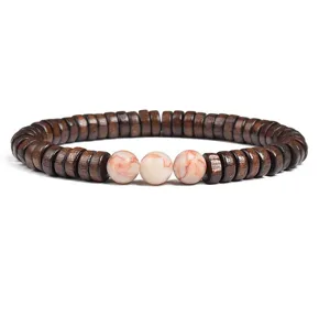 Detailed close-up of brown wooden spacer beads bracelet with natural stone round center beads.