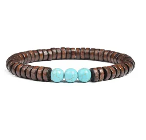 Close up detail of wooden disc spacer and turquoise stone beads bracelet, natural bohemian style.