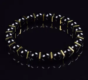 Schwarzes Perlenarmband mit goldenen Abstandshaltern Yoga Edelstein Schmuck Hauptbild