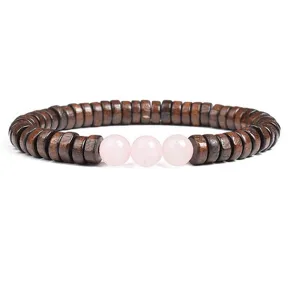 Detail view of the wooden spacer and pink crystal bead bracelet, elegant DIY jewelry gift.