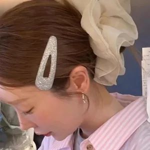 Close-up of elegant oversized white lace scrunchie as a stylish Korean hair accessory