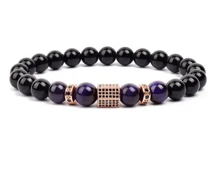 Close-up detail of beaded bracelet with purple tiger eye and micro-paved cubic spacer.