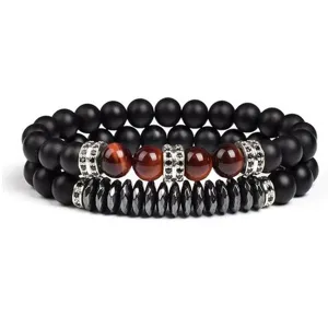 Detailed view of the 2-piece tiger eye and black stone beaded bracelet set with spacers.