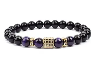 Beaded bracelet with purple and black stone beads and gold micro pave cube spacer.