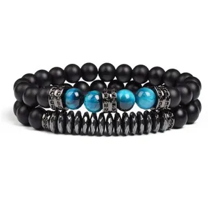 Set of two 8mm blue tiger eye and matte black beaded bracelets with crystal spacers detail.