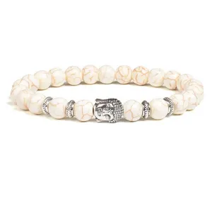Detail shot of the white crackle stone beaded bracelet featuring a silver Buddha head charm.