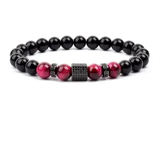 Beaded bracelet with red tiger eye and black beads, featuring a pave zircon square spacer.