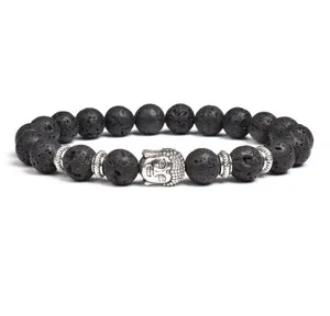 Close-up view of the black lava stone bracelet featuring a silver Buddha head charm.