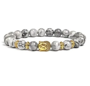Grey marble stone beaded bracelet with gold Buddha head and metal spacers for men and women.