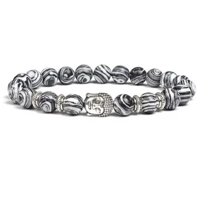 Black and white agate stone beaded stretch bracelet featuring a silver Buddha head charm.