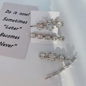 Close-up detail of silver alloy hair clips with sparkling crystal rhinestones