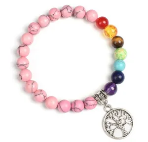 Charming 8mm pink turquoise chakra gemstone bracelet featuring a silver tree of life pendant.