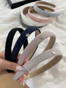 Collection of French vintage knit headbands in pastel colors with heart metal charms.