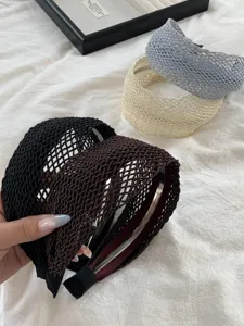 Serre-têtes larges tissés à la main en noir, marron, crème et bleu pour les vacances.