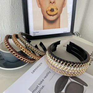 Close-up of woven PU leather and metal chain headbands in various colors