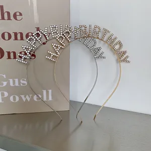 Detailed view of gold and silver rhinestone Happy Birthday headbands.