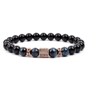 Details of stylish beaded bracelet featuring black beads blue tiger eye and cubic zirconia.
