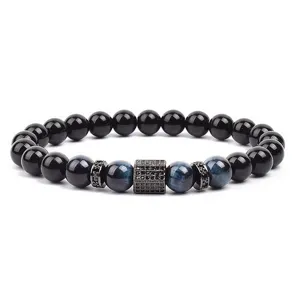 Close-up detail of the beaded bracelet showing blue tiger eye beads and micro pave zirconia spacer.