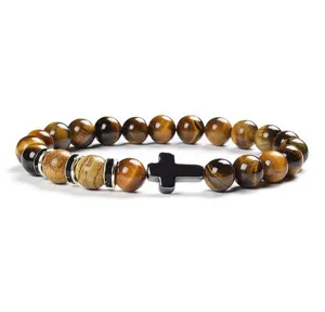 8mm yellow tiger eye and chalcedony beaded bracelet featuring a black cross charm detail.
