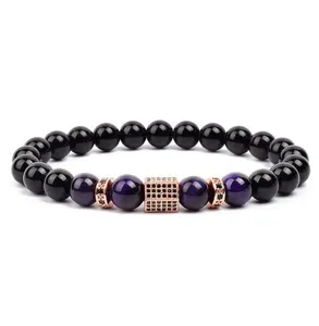 Detailed view of fashionable beaded bracelet with purple tiger eye and pave cubic zirconia.