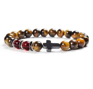 Detailed view of the 8mm yellow tiger eye stone and cross beaded bracelet for unisex wear.